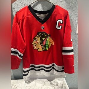 Reebok Jonathan Toews Youth L/XL Hockey NHL Jersey Red